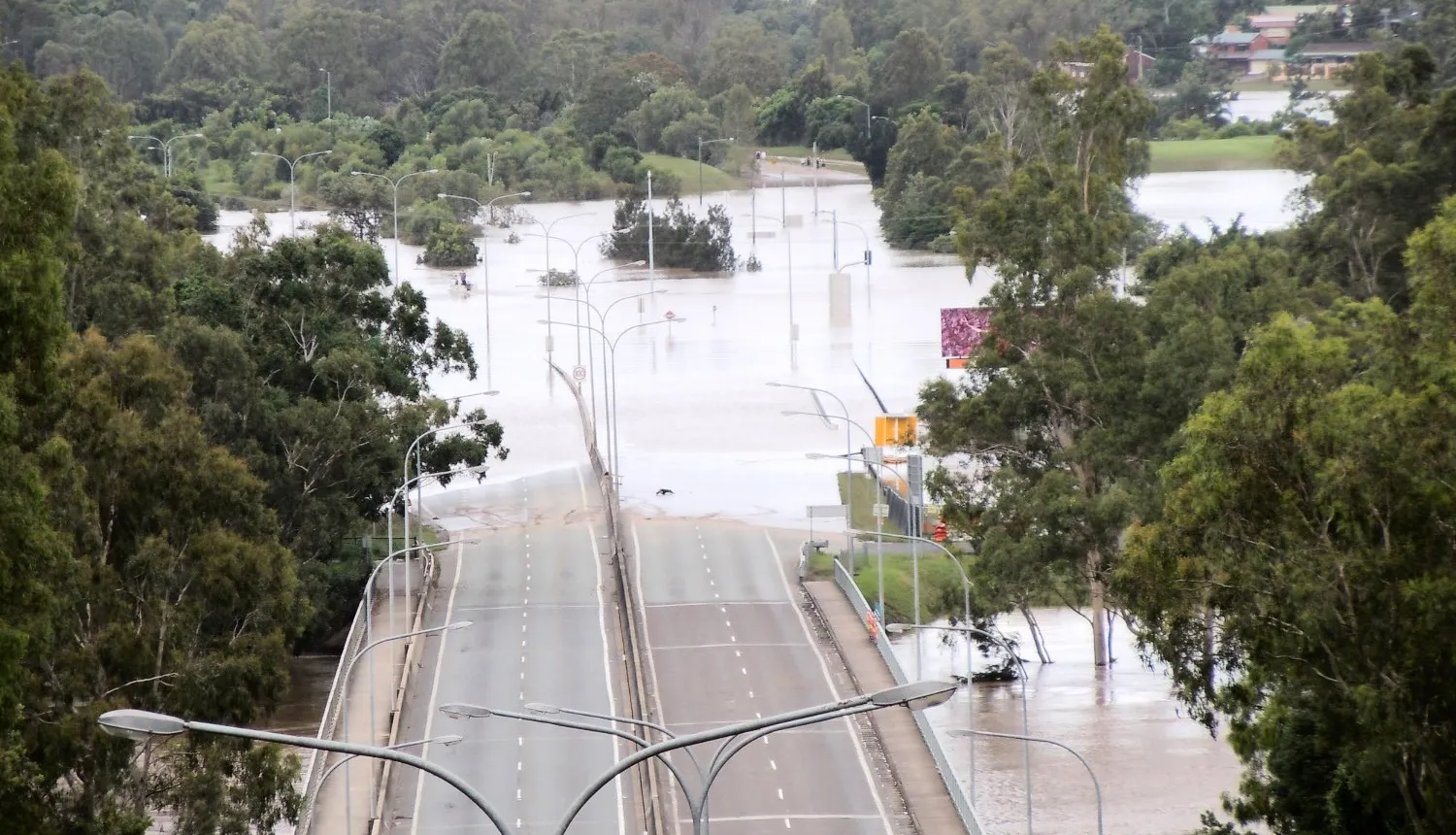 Flooded highway bridge approach following a major flood event