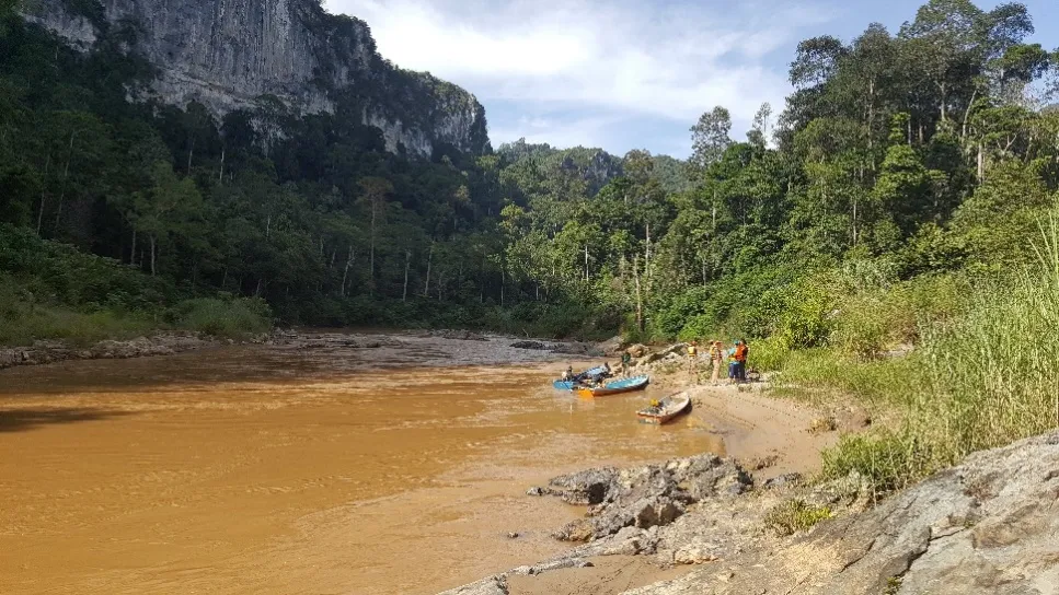 Boat survey team on the Nenggiri River gorge, Kelantan, Malaysia